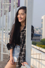 Obraz premium Portrait of thai china adult beautiful girl black shirt blue jeans relax and smile