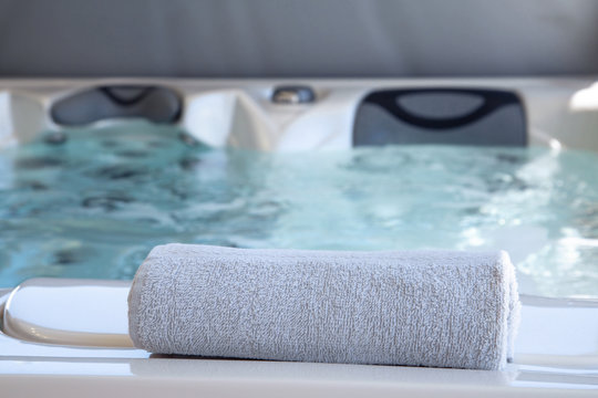 bath towel placed on the edge of a therapeutic spa
