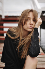 Stylish girl posing in stylish clothes