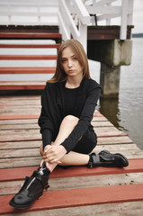 Stylish girl posing in stylish clothes