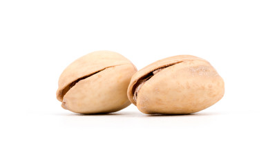 Obraz premium Two Salted Pistachio Nuts Isolated On A White Background
