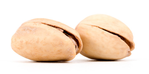 Two Salted Pistachio Nuts Isolated On A White Background