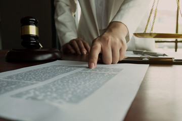 Fototapeta na wymiar Lawyer working with contract papers on the table in office. consultant lawyer, attorney, court judge, concept.