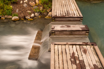 A long exposure of water tumbling down a step at the Liard Hot Springs, British Columbia, Canada, nobody in the image
