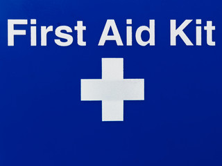 First aid sign on a blue background