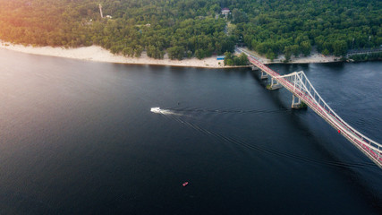 glass pedestrian and bicycle bridge. touristic place. Kiev, Ukraine. drone shot, bird's-eye, aerial view