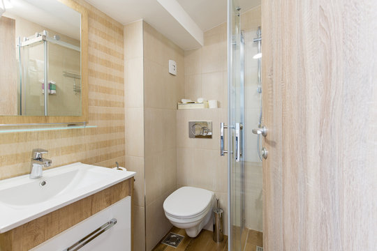 Hotel bathroom interior with shower cabin