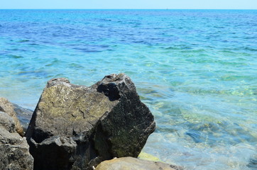 Fototapeta na wymiar Crystal blue Black Sea and stones in Bulgaria, Nessebar island