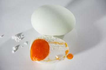 salted egg cut half showing yolk 