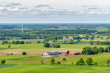 Fototapeta na wymiar View of a rural landscape with fields and farm