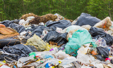 garbage dump pile in trash dump or landfill,truck is dumping the gabage from municipal,pollution concept