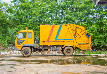 Fototapeta na wymiar Garbage truck park in garbage dump, pollution concept.