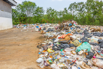 garbage dump pile in trash dump or landfill,truck is dumping the gabage from municipal,pollution concept