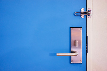 Metal knob on the blue door.