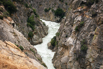 Fototapeta na wymiar Fast flowing river in rocky gorge, Kings Canyon, California