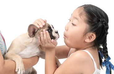 Happy asian kid girl play with french bulldog
