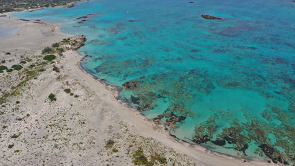 Obraz na płótnie Canvas Aerial drone panoramic view photo of famous exotic paradise sandy deep turquoise beach of Elafonissi in South West Crete island, Greece