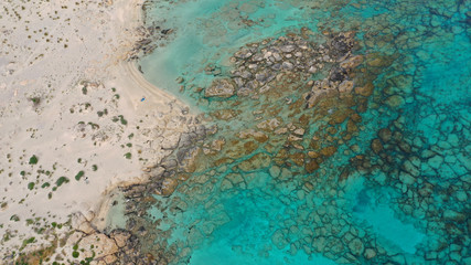 Aerial drone panoramic view photo of famous exotic paradise sandy deep turquoise beach of Elafonissi in South West Crete island, Greece