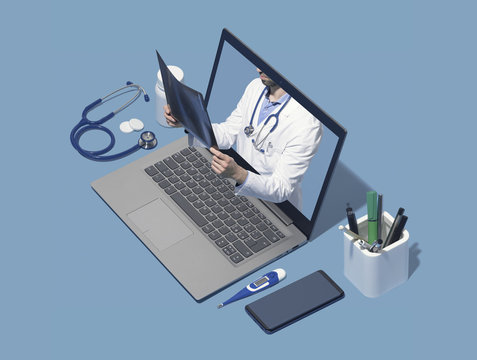 Professional doctor giving a consultation online in a laptop