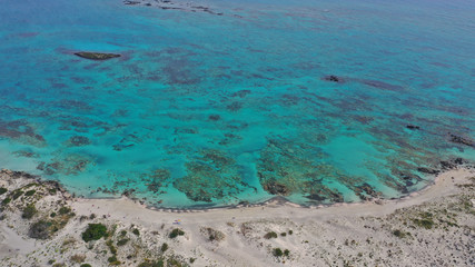 Aerial drone panoramic view photo of famous exotic paradise sandy deep turquoise beach of Elafonissi in South West Crete island, Greece