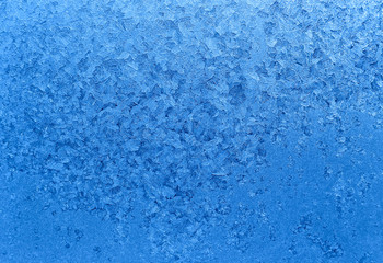Fototapeta na wymiar Natural ice pattern on winter glass