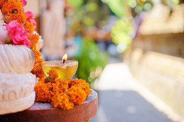 Religious decoration. Candle with flowers.