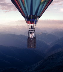 Hot air balloon above mountains