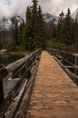 The empty wooden rustic bridge leading across to Pyramid Island on Pyramid Lake, Jasper National Park, Canada, nobody in the image