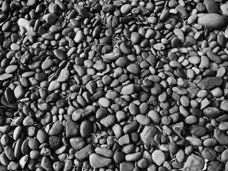 black stone background , pebbles on the beach