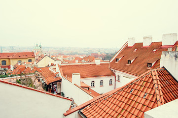 Travel and architecture. Cityscape with red tiled roofs view. Prague, Czech Republic.