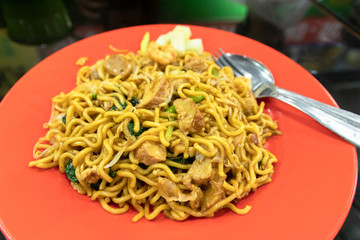 Indonesian stir-fried noodles (Bakmi Goreng) with chicken or seafood, a street-food noodle classic from Java island. 