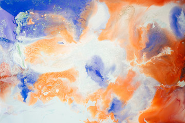 Liquid paper orange and blue paint background. Fluid painting abstract texture, art technique. Colorful mix of acrylic vibrant colors. Creativity and painting. Background for design, printing, pattern