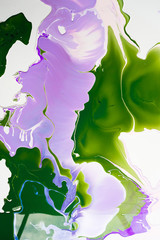 Liquid paper purple and green paint background. Fluid painting abstract texture, art technique. Colorful mix of acrylic vibrant colors. Creativity and painting. Background design, printing, pattern