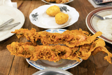 Warung Nasi Padang restaurant. Crunchy shrimp crisp and deep fried egg on the table one of the most famous meals to be associated with Indonesia, a mix of rice and side dishes. 