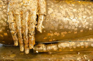 Close up hand of golden Buddha Statue