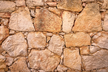 Old wall made of large and small stones 2