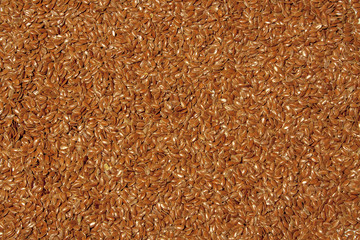Background of flax seeds closeup. View from above.