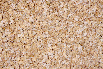 Background of oatmeal closeup. View from above.