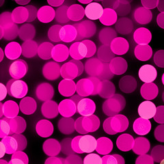 Unfocused abstract colourful bokeh purple background. defocused and blurred many round purple light