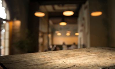 blurred background of bar and dark brown desk space of retro wood