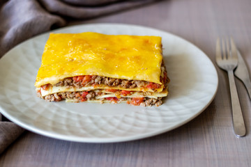 Lasagna on a gray background. Italian cuisine.
