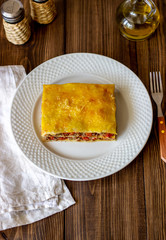 Lasagna on a wooden background. Italian cuisine.