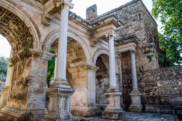 Fototapeta na wymiar Adrian Gate, Antalya landmark, Turkey. Antique construction of marble and limestone.