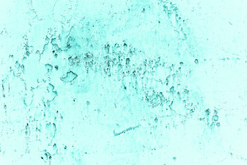 Vintage azure background. Rough painted wall of turquoise color. Imperfect plane of cyan colored. Uneven old decorative toned backdrop of aqzure tint. Texture of teal hue. Ornamental stony surface.