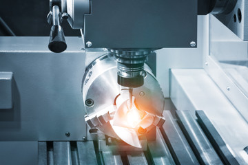 metalworking industry. drilling a hole on modern metal working machining center