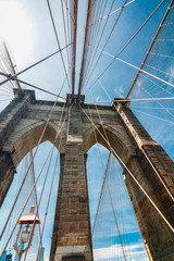 Brooklyn Bridge, New York City. Architectural Close up  Detail, An Iconic Steel Cables against Bright Sun and Blue Sky
