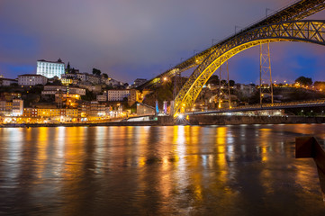 Fototapeta na wymiar The Dom Luis I bridge at night, Porto, Portugal.