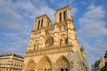 Fototapeta na wymiar Scenic view of catholic cathedral of Our Lady of Paris (Notre-Dame de Paris) in old touristic historic city Paris. Beautiful summer happy look of old christian temple in ancient capital of France