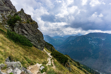 Fototapeta na wymiar Mountain trail under the clouds in the Western Tatras.