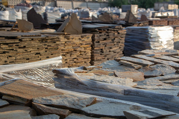Pallets with natural facing stone and cobblestones